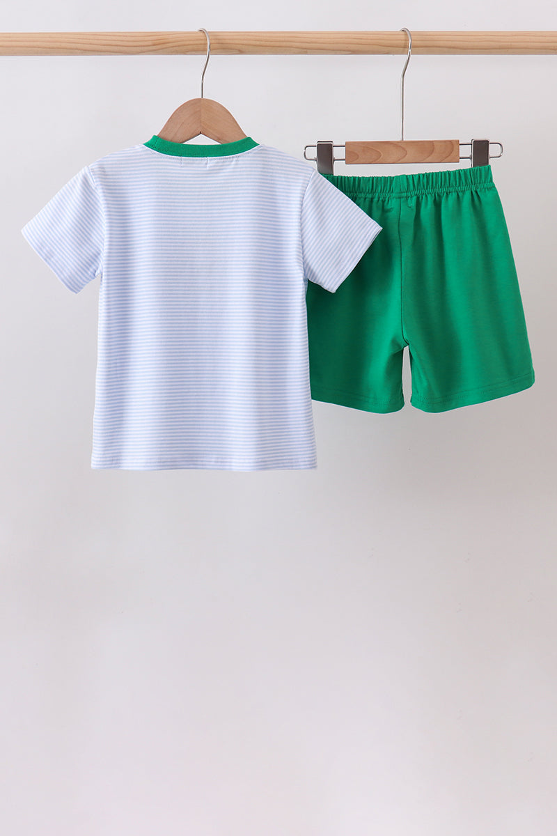 Blue Stripe Duck Embroidery Shorts Set for Girls hanging on a wooden hanger, featuring a striped top and green shorts.